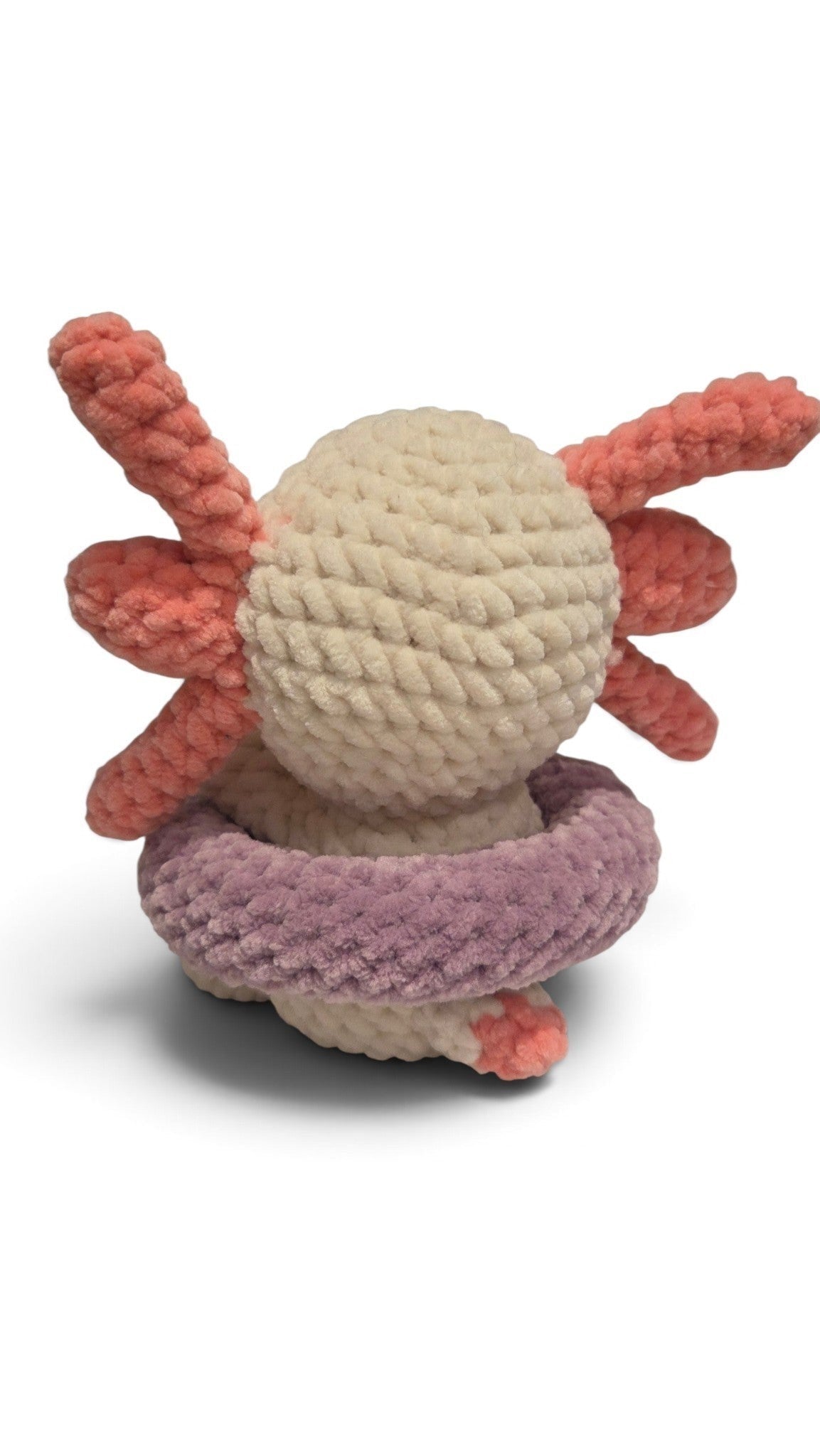 BrainRotPop handmade crochet axolotl plush toy in off-white with coral-pink gills and a purple swimming ring.