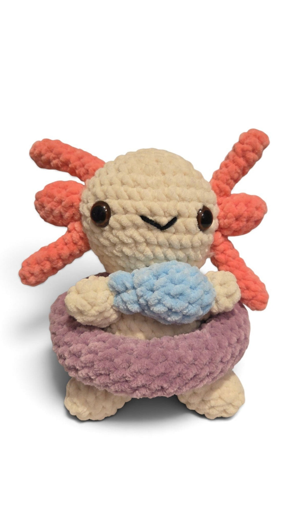 BrainRotPop handmade crochet axolotl plush toy in off-white with coral-pink gills and a purple swimming ring