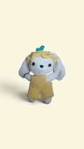 BrainRotPop handmade crochet bunny plushie in white yarn wearing yellow dungarees and a matching sun hat