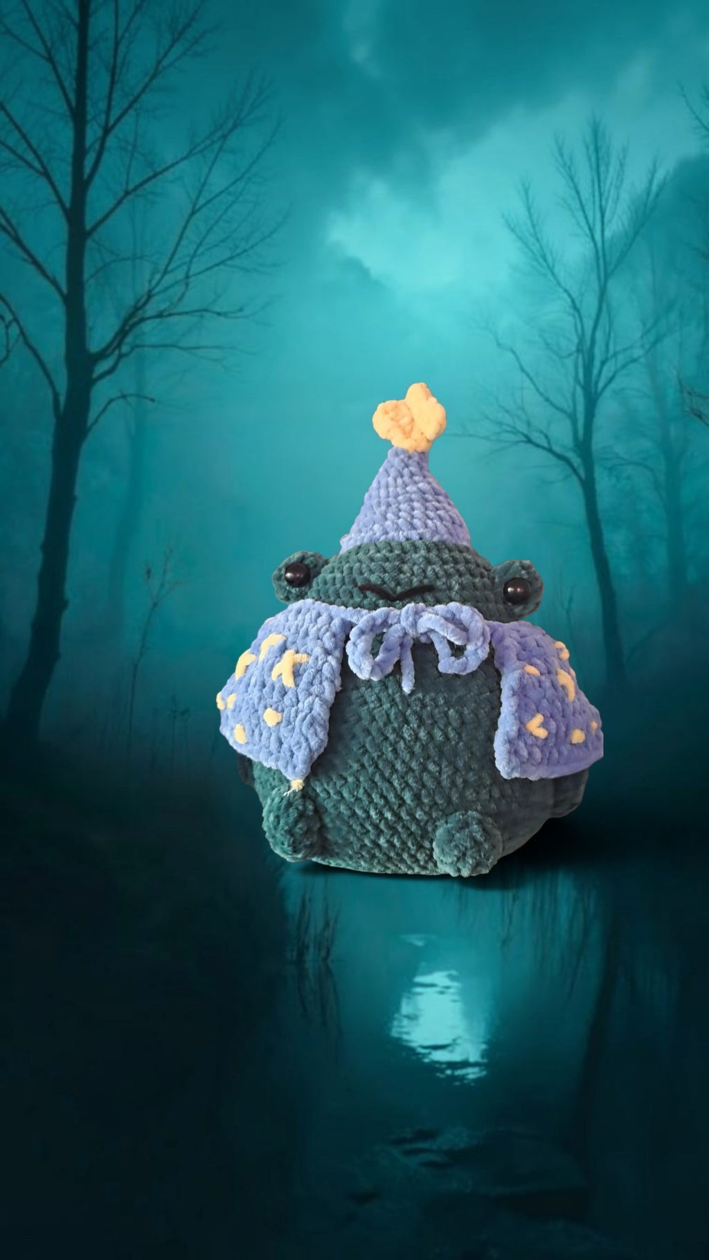 BrainRotPop handmade forest green crochet frog plushie wearing a periwinkle blue wizard hat and star-patterned cape.
