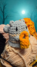 BrainRotPop handmade grey and orange crochet plushie toy made from soft chunky chenille yarn